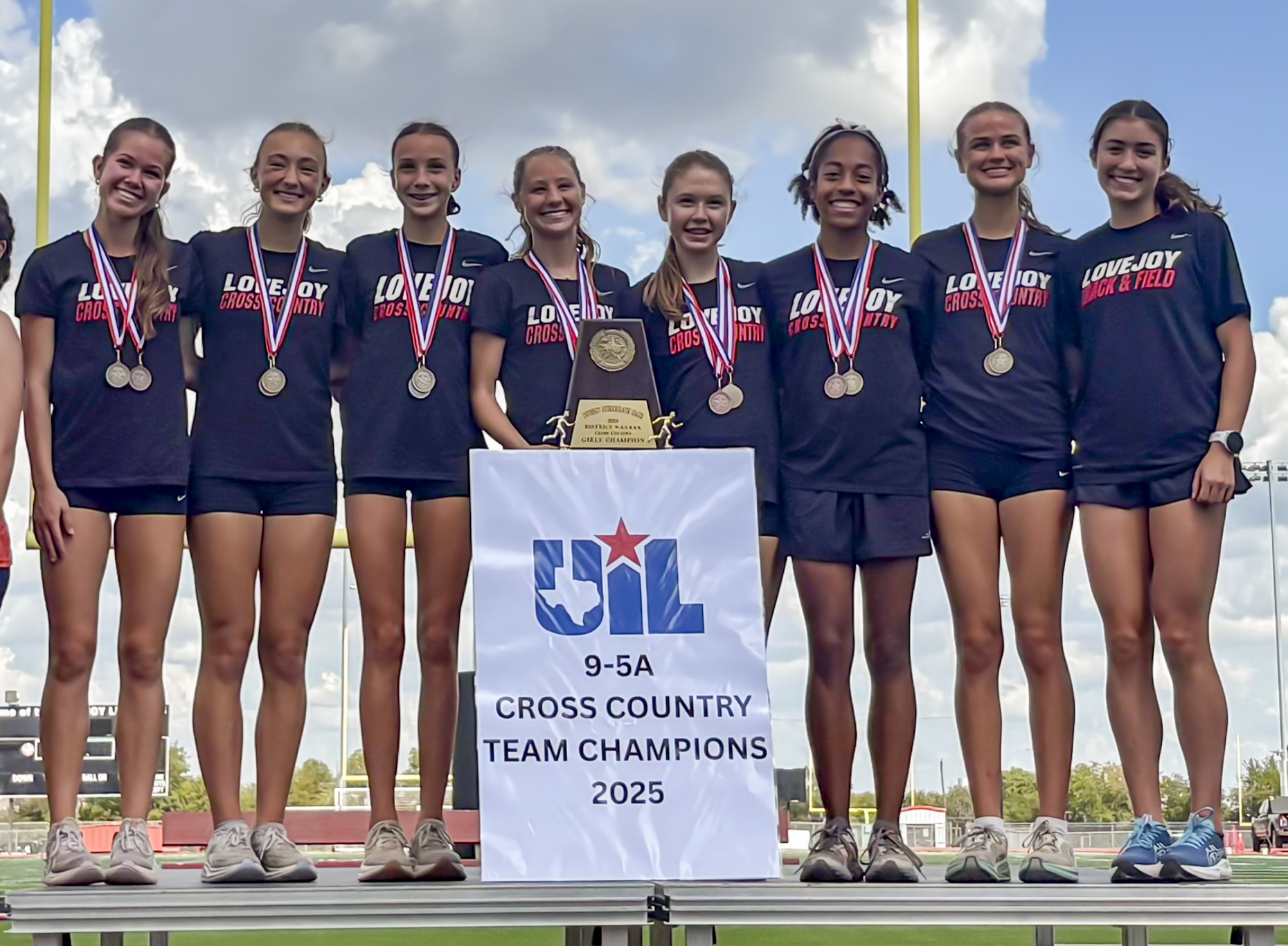 Varsity Girls on the podium at District